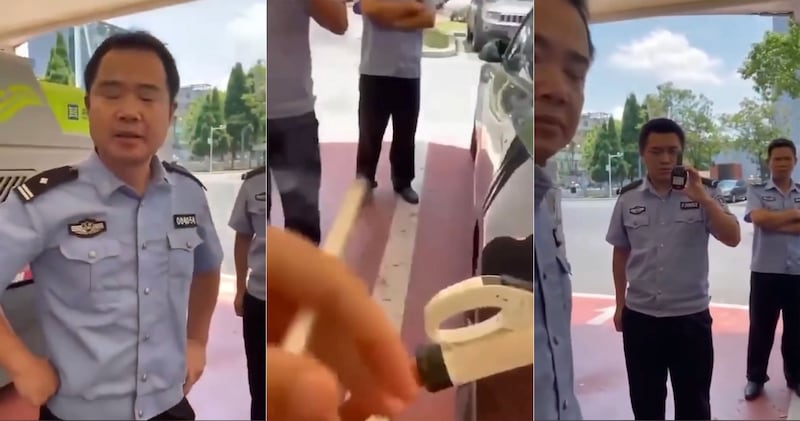 一特斯拉车主充电时,被三名警察阻挠。车主要求警察出示相关法律文件,警察一时语塞。(翻拍自视频/古亭提供)