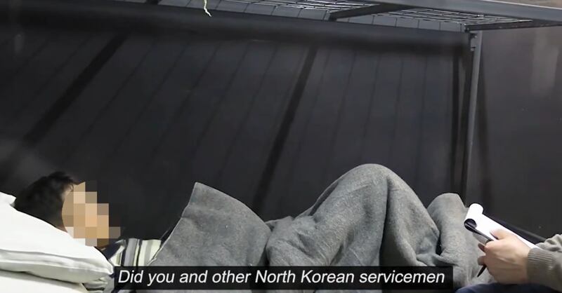 Ukraine President Volodymr Zelenskyy says this image made from a video he released shows a North Korean soldier captured by Ukraine in Kursk. Part of the image has been blurred by RFA.