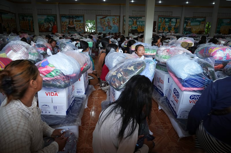 Local villagers wait to receive supplies donated by a charity in Srey Snam district, Siem Reap province, Cambodia, July 28, 2025, amid the fighting between Thailand and Cambodia.