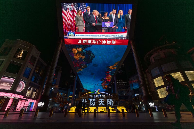 The evening news on Chinese state media reports on Republican presidential nominee Donald Trump on an outdoor screen in Beijing, Nov. 6, 2024.