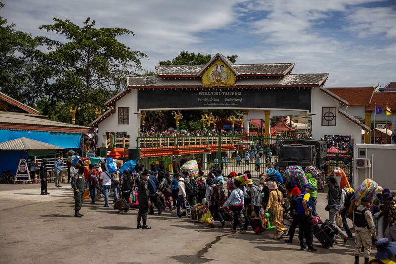 Cambodian migrant workers cross the Ban Laem border checkpoint in large numbers with all of their belongings on July 29, 2025 in Chanthaburi, Thailand.