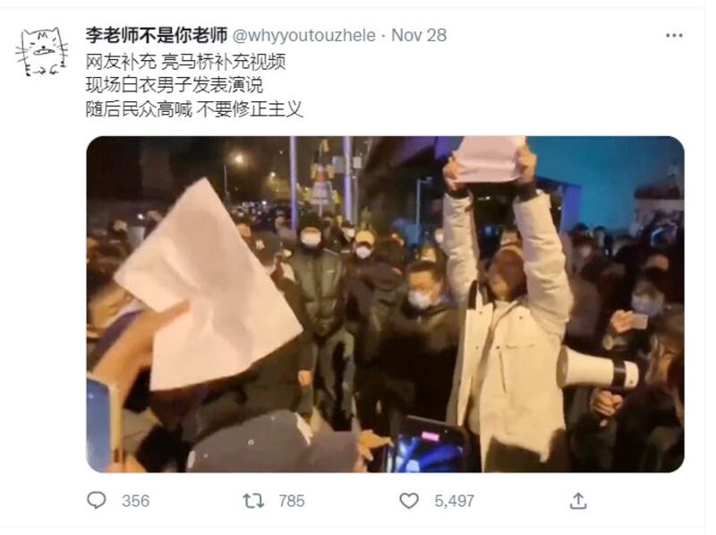 A protester in China speaks to a crowd in this screenshot from video posted on the “Mr. Li is not your teacher” Twitter account Nov. 29, 2022.