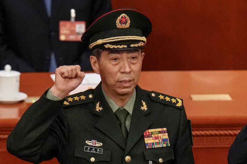 Chinese Defense Minister Gen. Li Shangfu takes his oath during a session of China's National People's Congress in Beijing on March 12, 2023. Credit: Andy Wong/AP