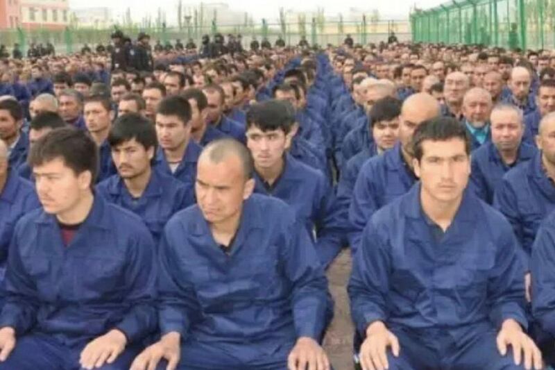 A photo posted to the WeChat account of the Xinjiang Judicial Administration shows Uyghur detainees listening to a “de-radicalization” speech at a re-education camp in Hotan prefecture’s Lop county, April 2017.