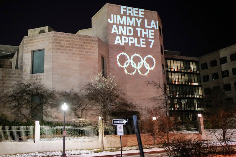 In this image provided by The Committee for Freedom in Hong Kong, an artist projection by Robin Bell protests China's crackdown on dissidents ahead of the 2022 Beijing Winter Olympics in Washington, Jan. 31, 2022.